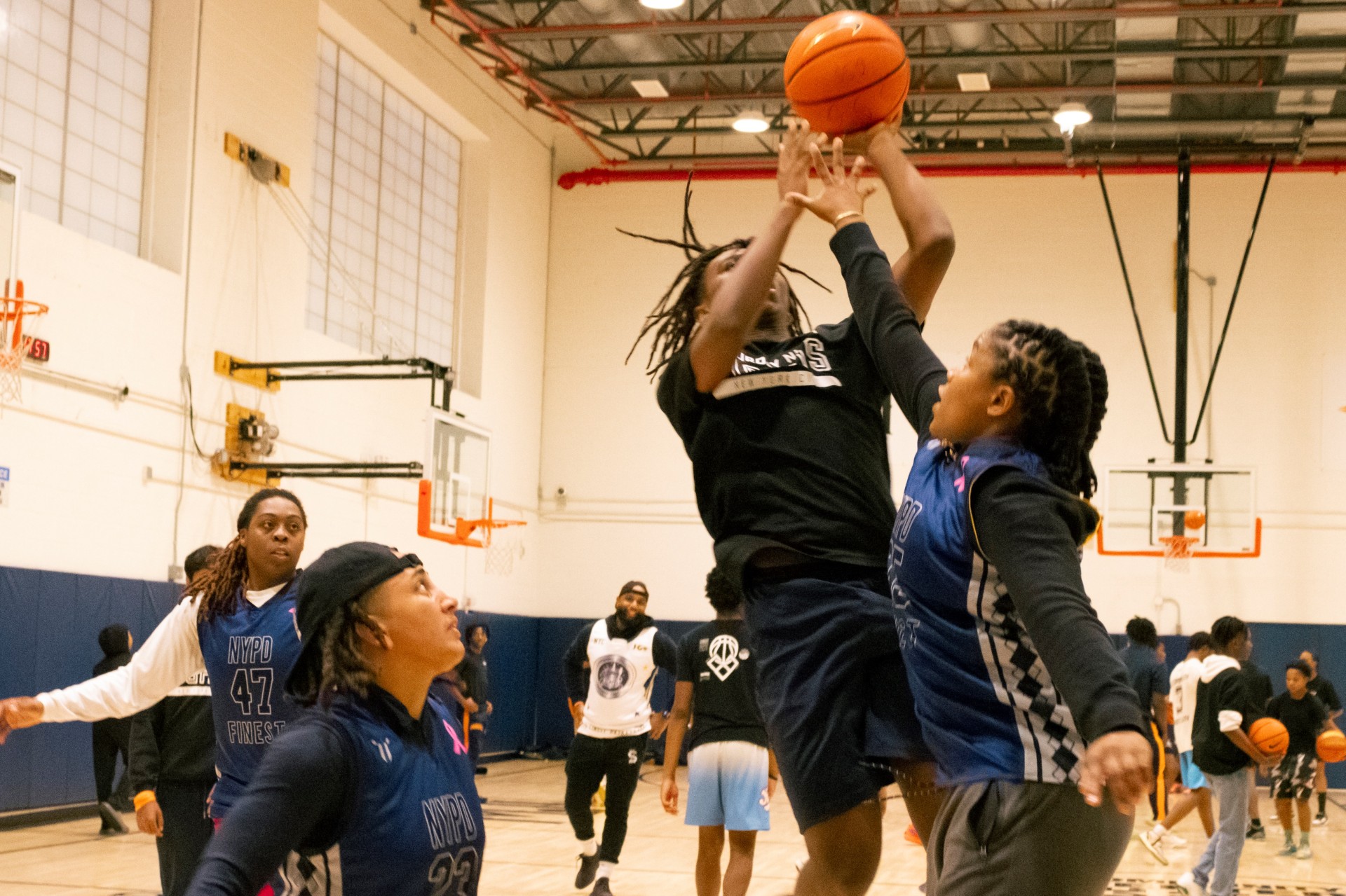 Youngsters playing Basketball in a Gym